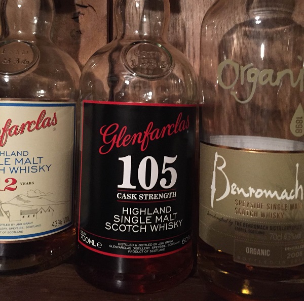 Glenfarclas 105 with brother Glenfarclas 12 on the left and an organic Benromach on the right